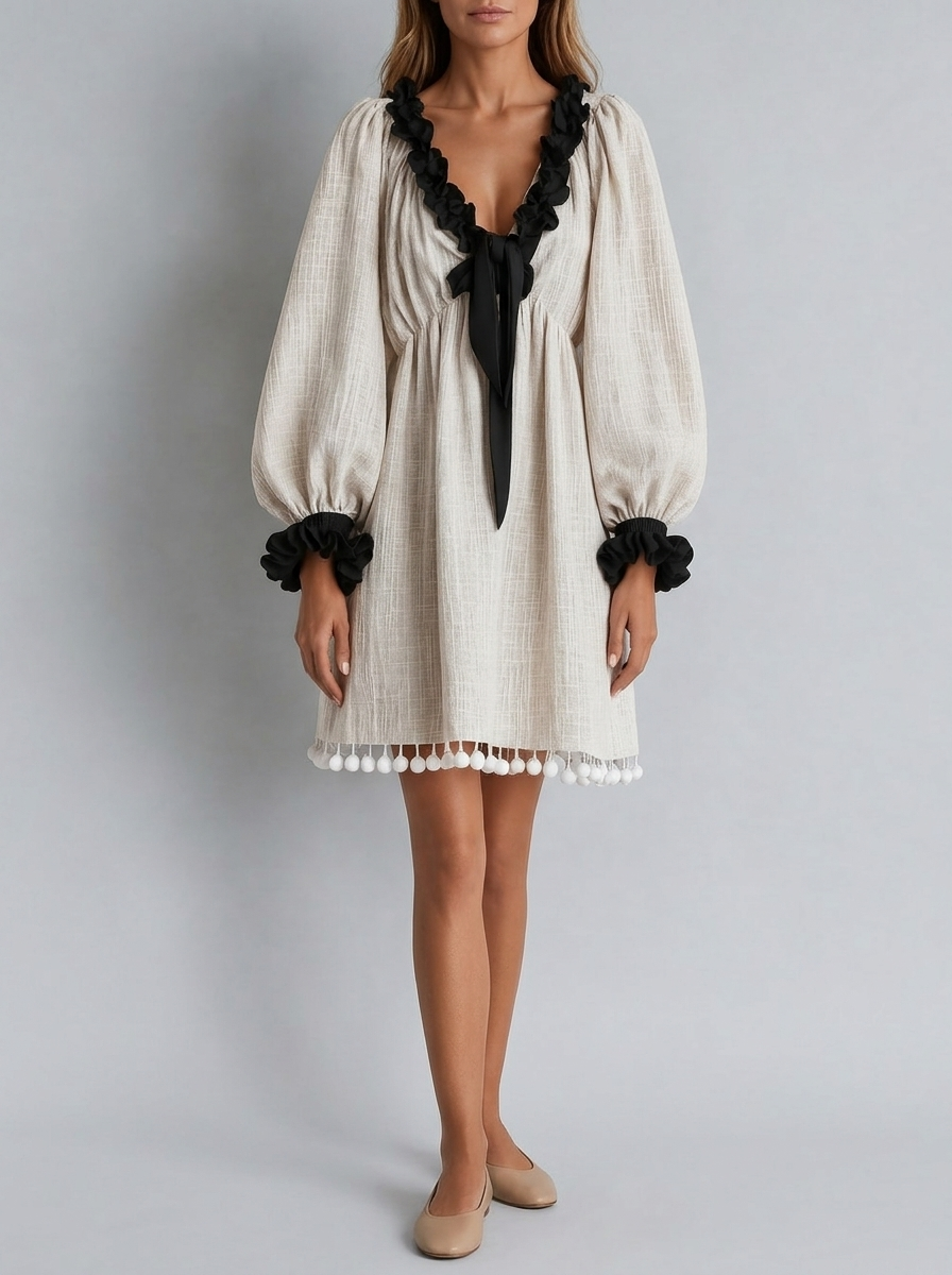 Vestido recto con mangas abullonadas y borlas